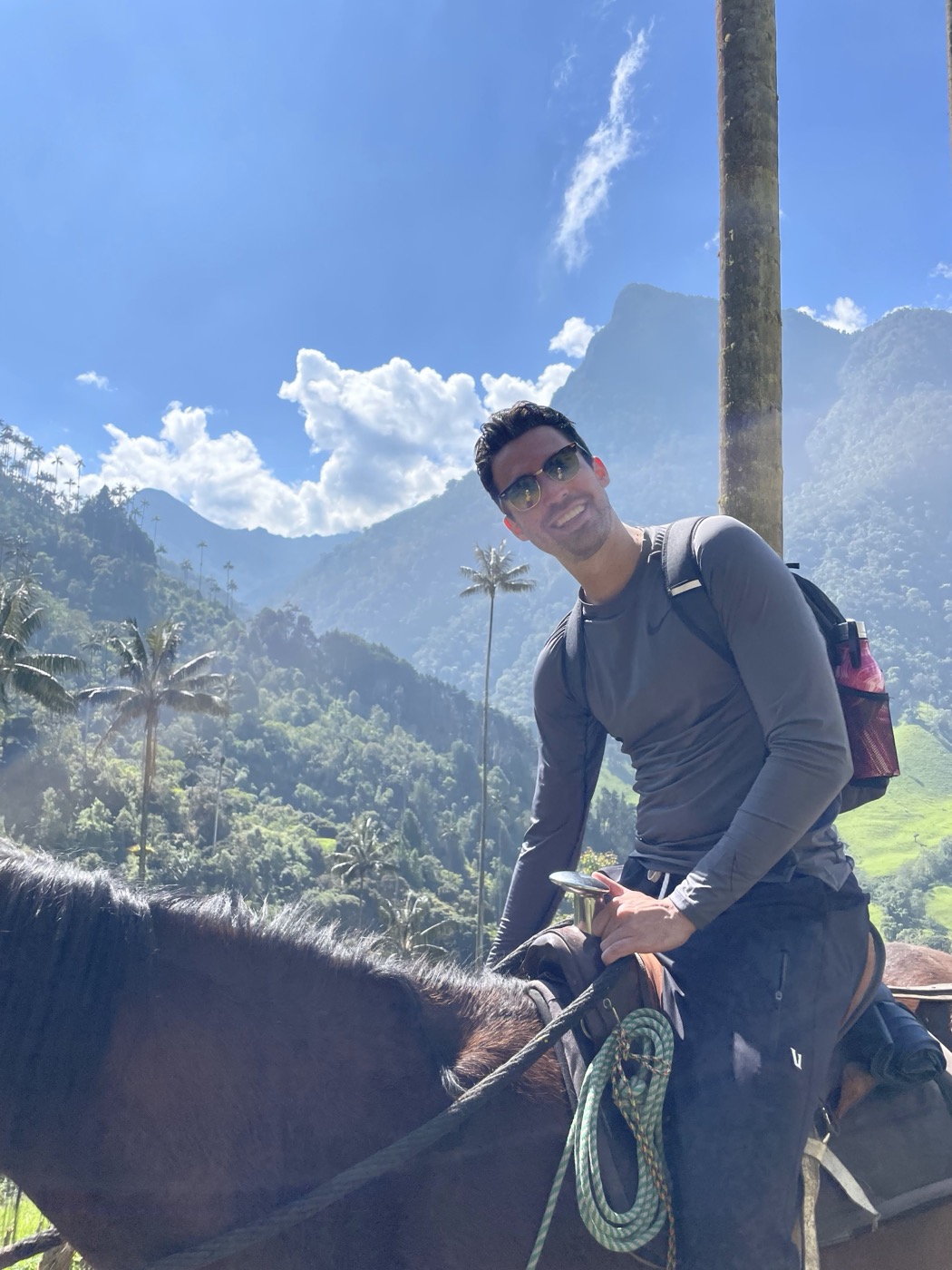 On horseback in the Valle de Cocora, Colombia, surrounded by towering wax palms